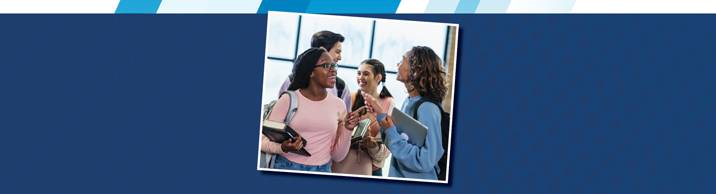 two teens talking in a crowded hallway at school