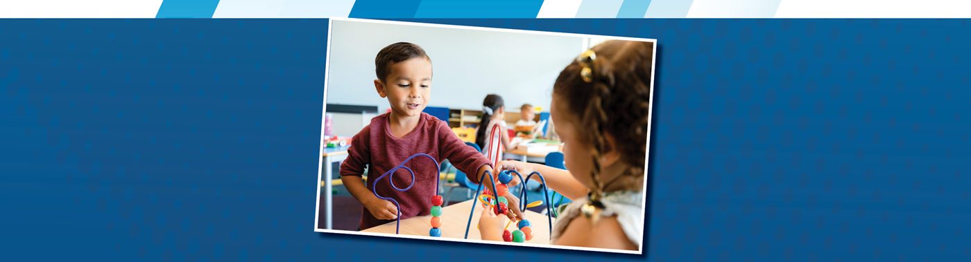 two young kids playing with bead counter