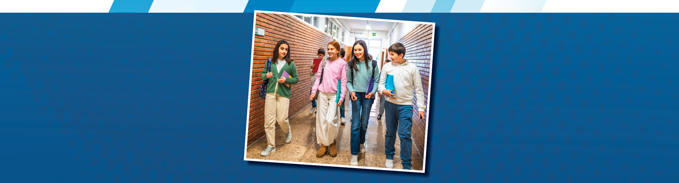 a group of middle school students walking down the hallway