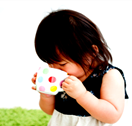 toddler sips from drinking cup