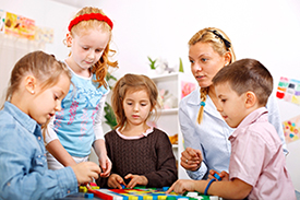 photograph of a group of elementary students working together