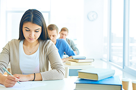 photograph of students testing in a classroom