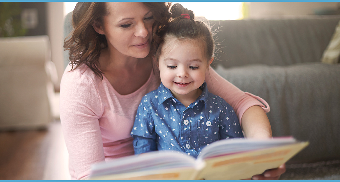 adult and child reading a storybook
