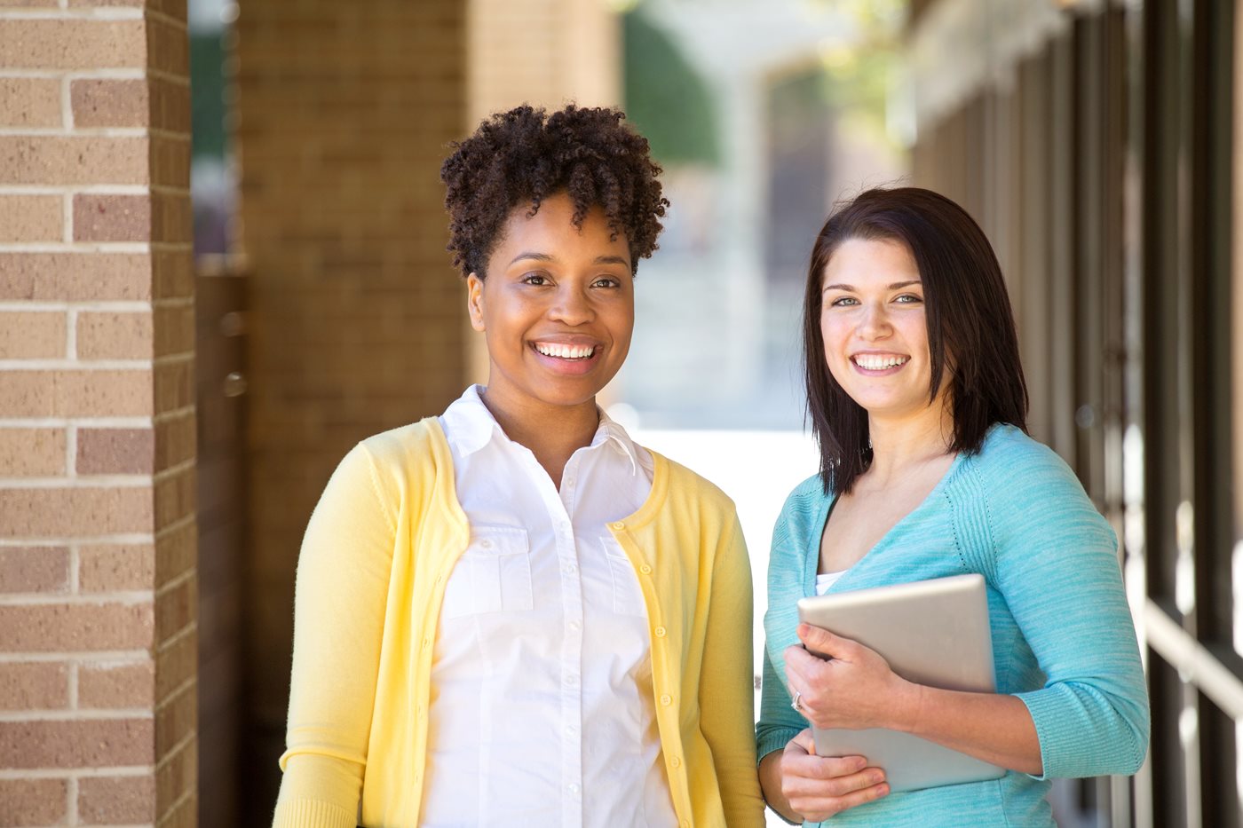 Business women standing outside an office building