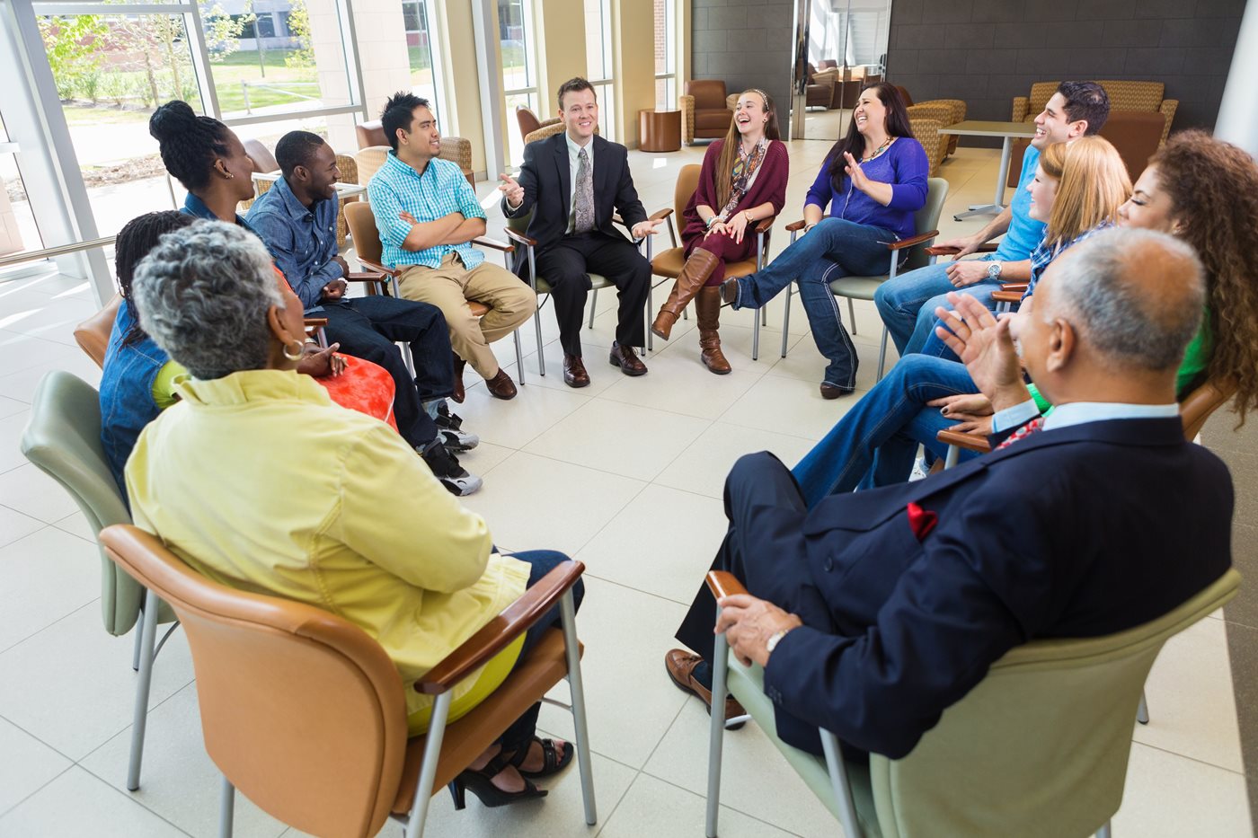 Administrator talking to teachers in circle